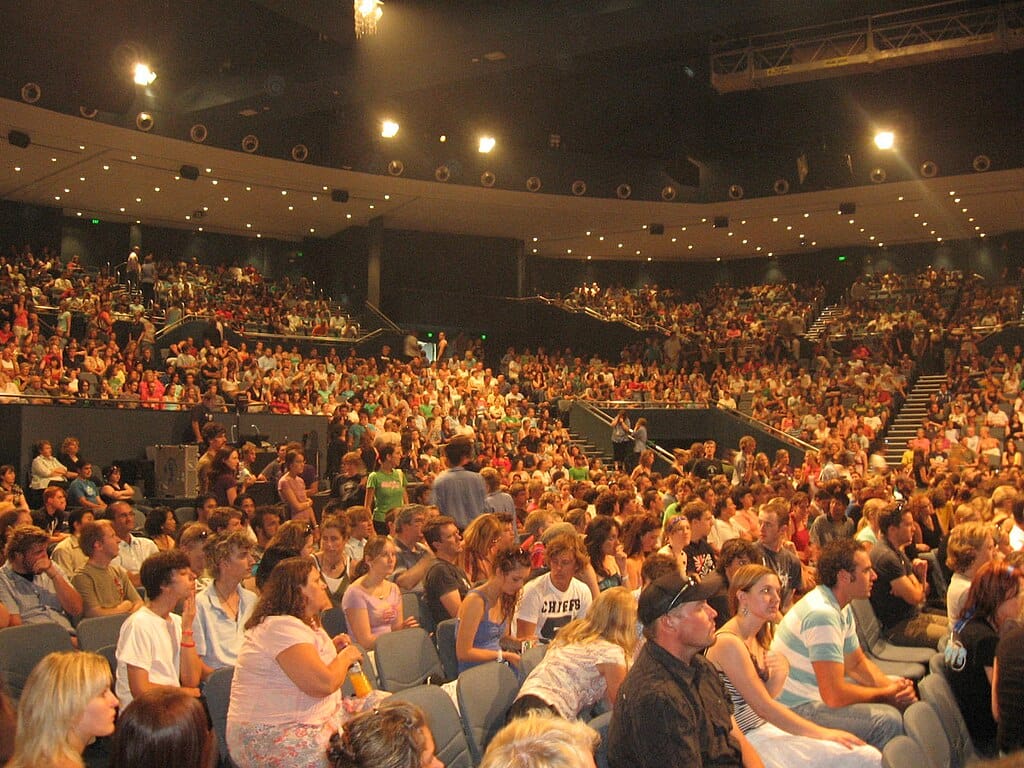 A large audience seated in an auditorium at Hillsong Church, Sydney.